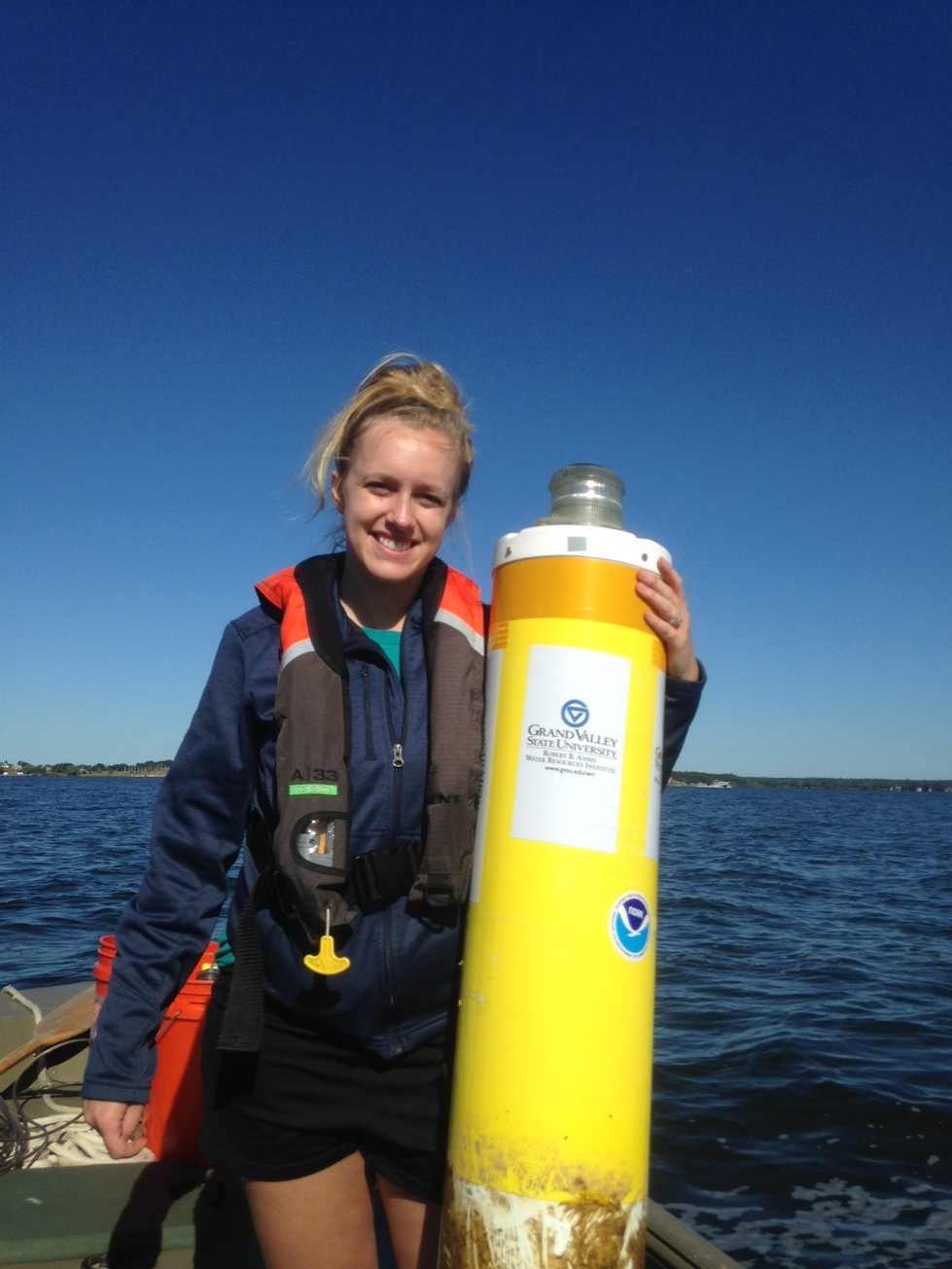Katie Knapp holding a sensor marker buoy